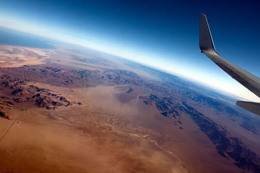 Plane flying over remote location